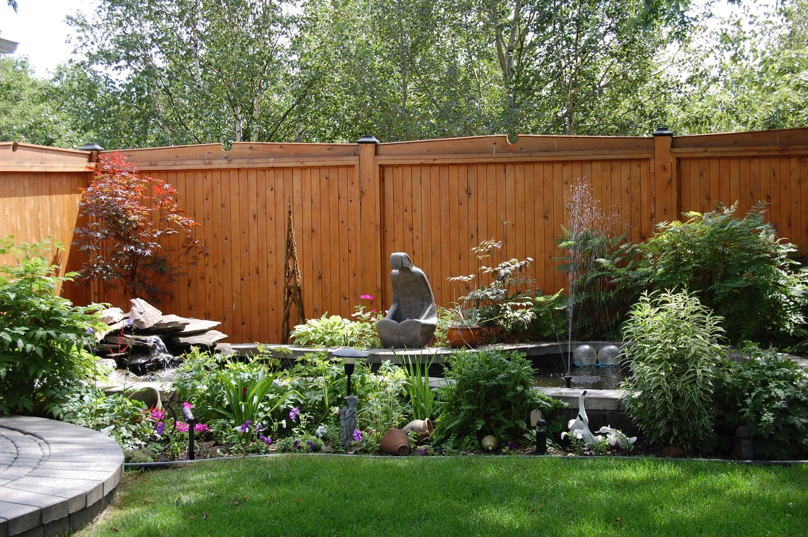Backyard garden with professional landscaping service.